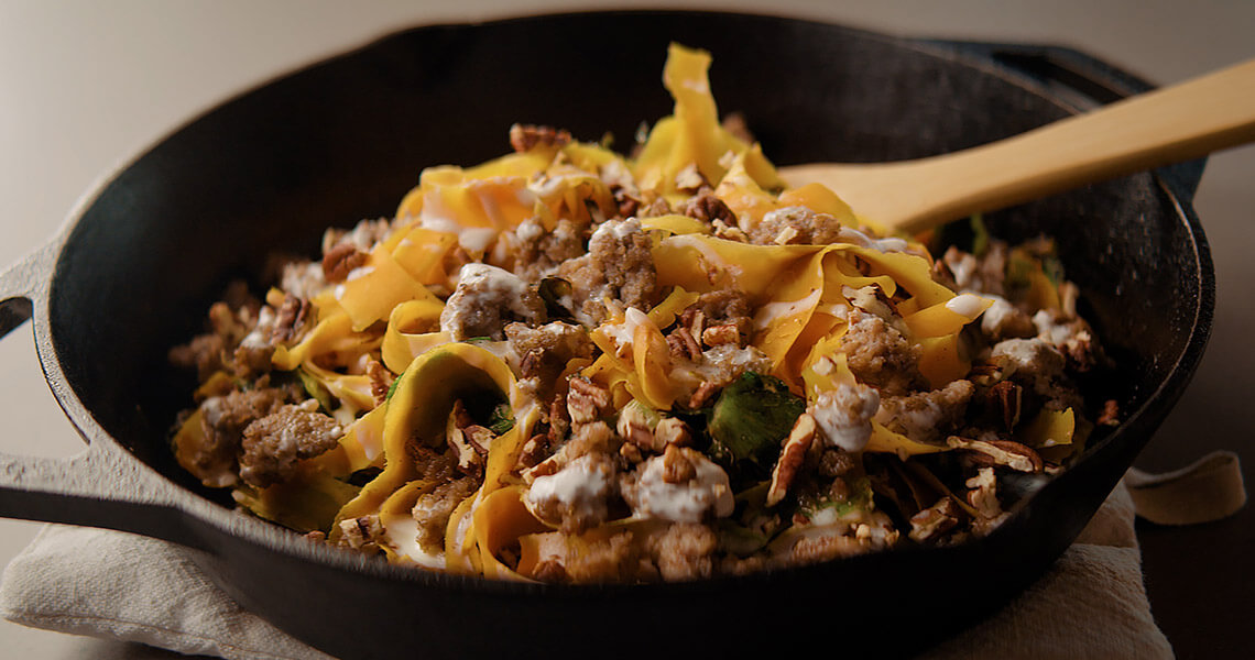 Skillet of Butternut Squash Ribbons with Sausage