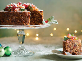 Southern Supreme fruitcake on a Christmas table setting.