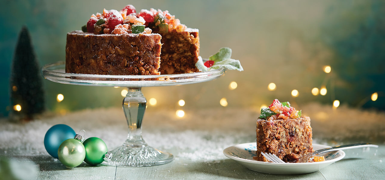 Southern Supreme fruitcake on a Christmas table setting.
