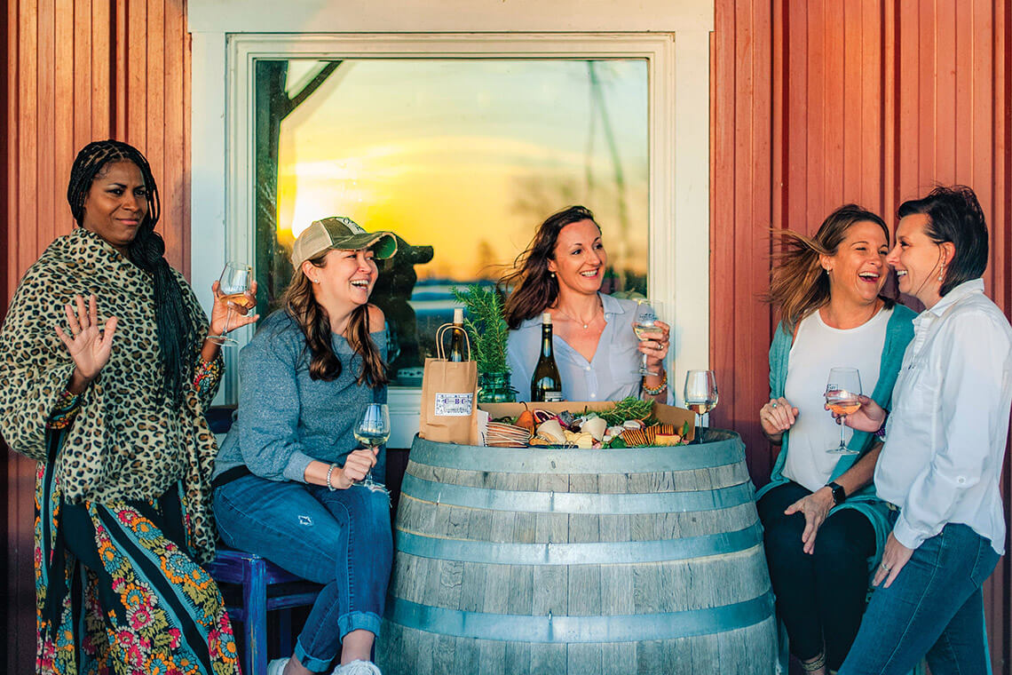 Ladies drink wine at Sanctuary Vineyards in Currituck, North Carolina