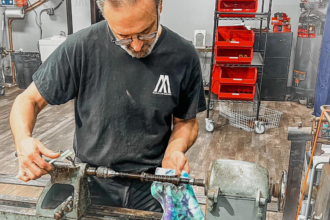 Artist crafts pieces of bagpipes at MacLellan Bagpipes