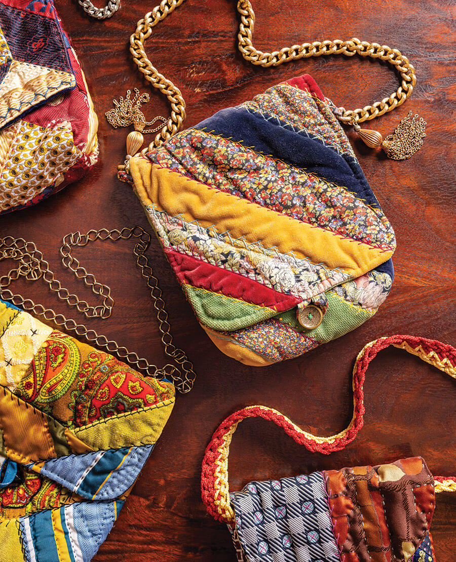 Collection of patchwork purses with gold straps