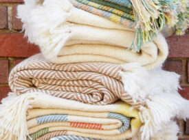 Stack of blankets made by Local Cloth in the Asheville River Arts District