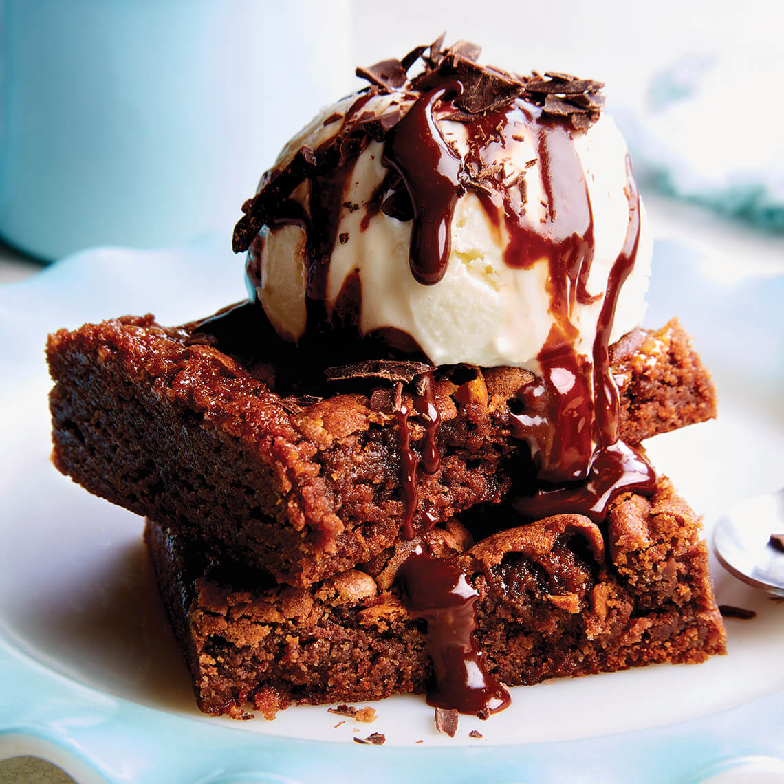 Brownies topped with ice cream and hot fudge