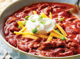 Chili topped with sour cream and cheese