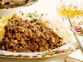 A traditional Burns Night dinner includes a platter of haggis, neeps, tatties, and cock-a-leekie soup