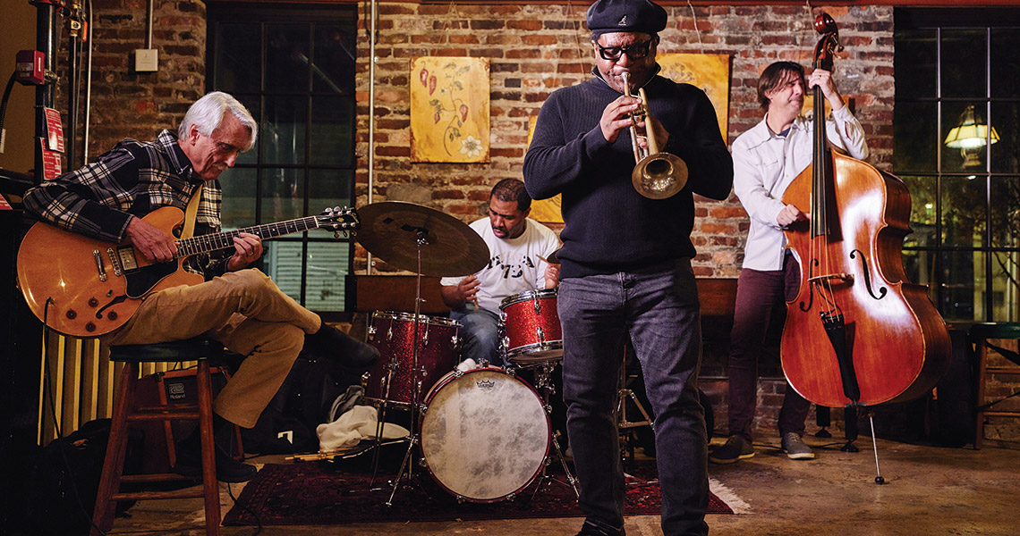 arcus Printup jams with members of UNCG’s music faculty, including guitarist Greg Hyslop, drummer Brevan Hampden, and bassist Steve Haines.