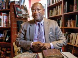 Lenard D. Moore in a bookstore with his book, The Geography of Jazz