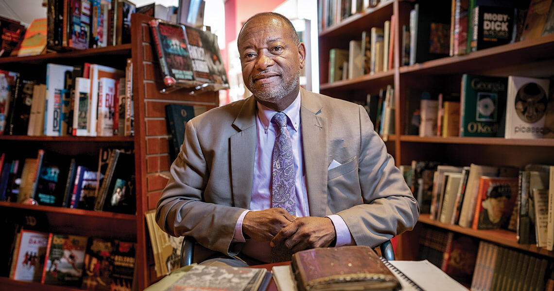 Lenard D. Moore in a bookstore with his book, The Geography of Jazz