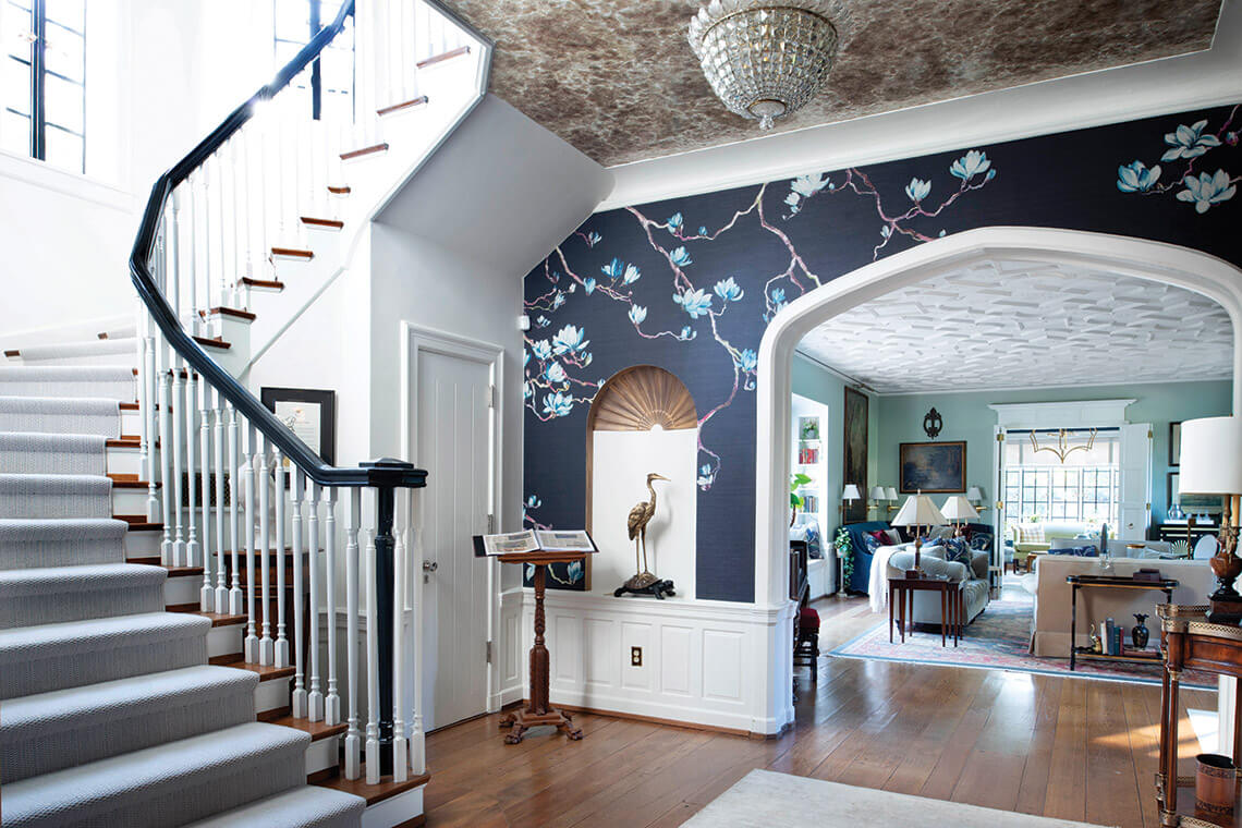 The grand staircase and living room welcoming guests to the inn. 