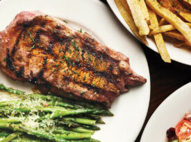 Plate of steak with green beans and fries, served at Kimber's Steakhouse