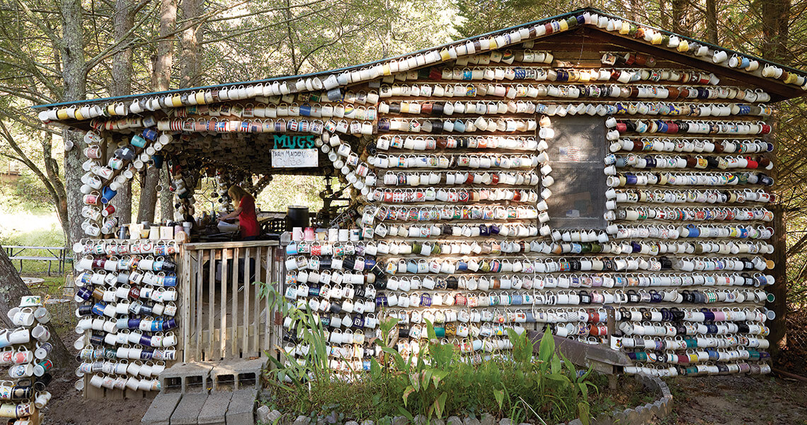 Coffee mugs hang from every surface at the House of Mugs