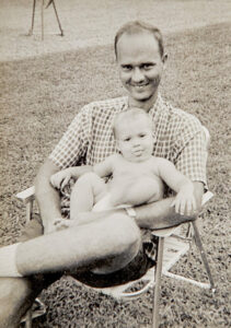 The author, age one, with her father,
