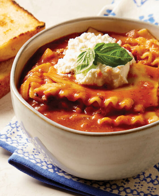 Bowl of lasagna soup topped with ricotta.