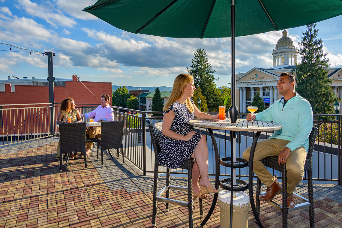 People on the rooftop terrace at Shine in downtown Hendersonville.