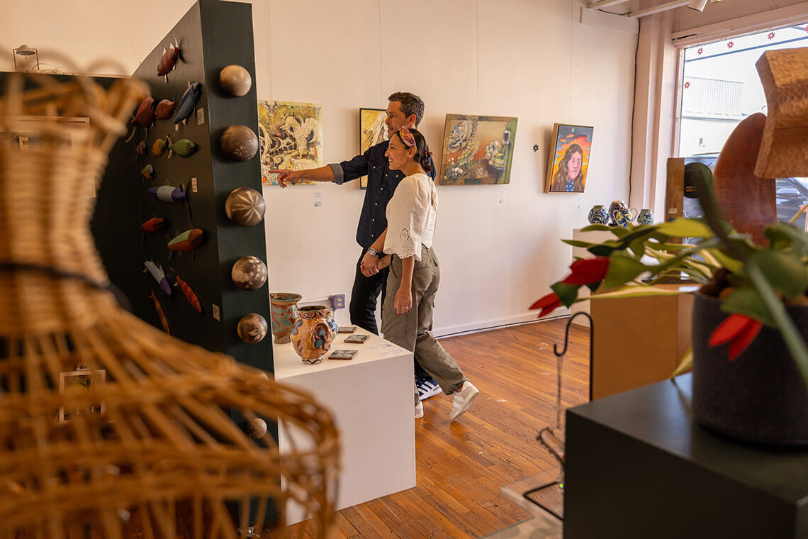 Couple shopping at Piedmont Craftsmen Gallery in Winston-Salem