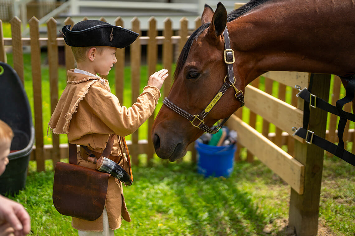 Child with horse at Halifax State Historic Site