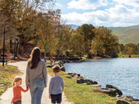 Parent and children walk along the GROW Trail at Lake Tomahawk.