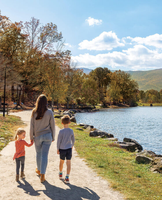 Parent and children walk along the GROW Trail at Lake Tomahawk.