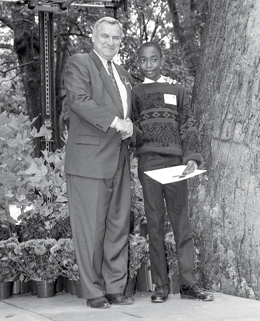 Sixth grader Kedrick Perry and Dean Smith at UNC Chapel Hill