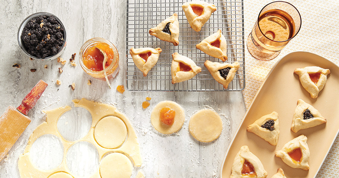 Making hamantaschen cookies in the kitchen