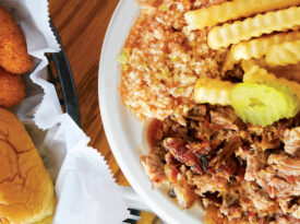 Plate of Lexington-style barbecue, fries, slaw, and hush puppies in Lexington, NC