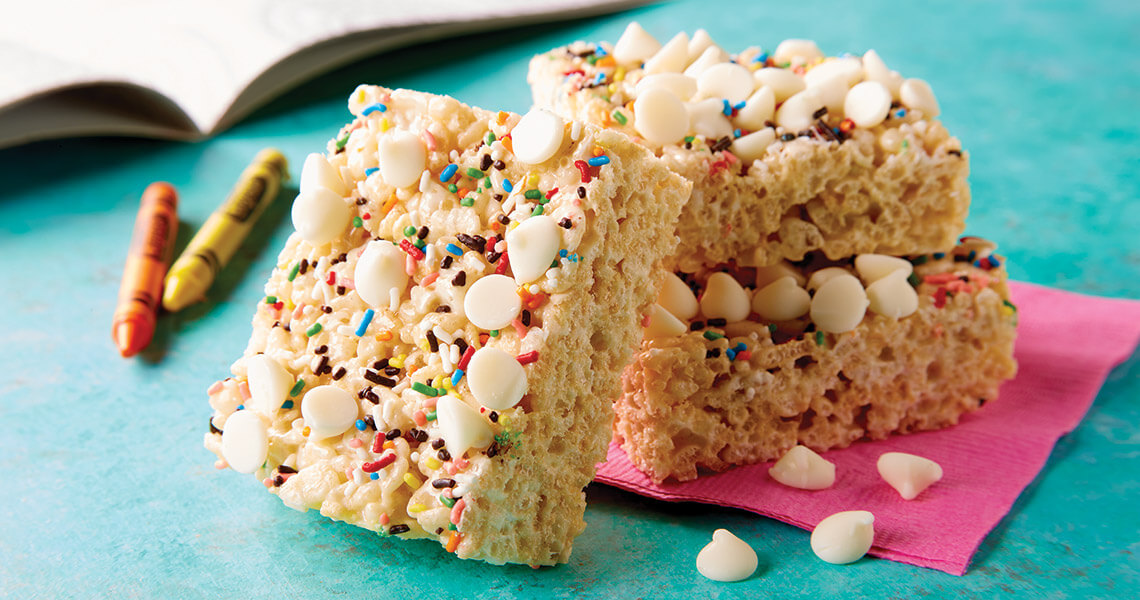 Crispy rice treats with rainbow sprinkles and white chocolate chips
