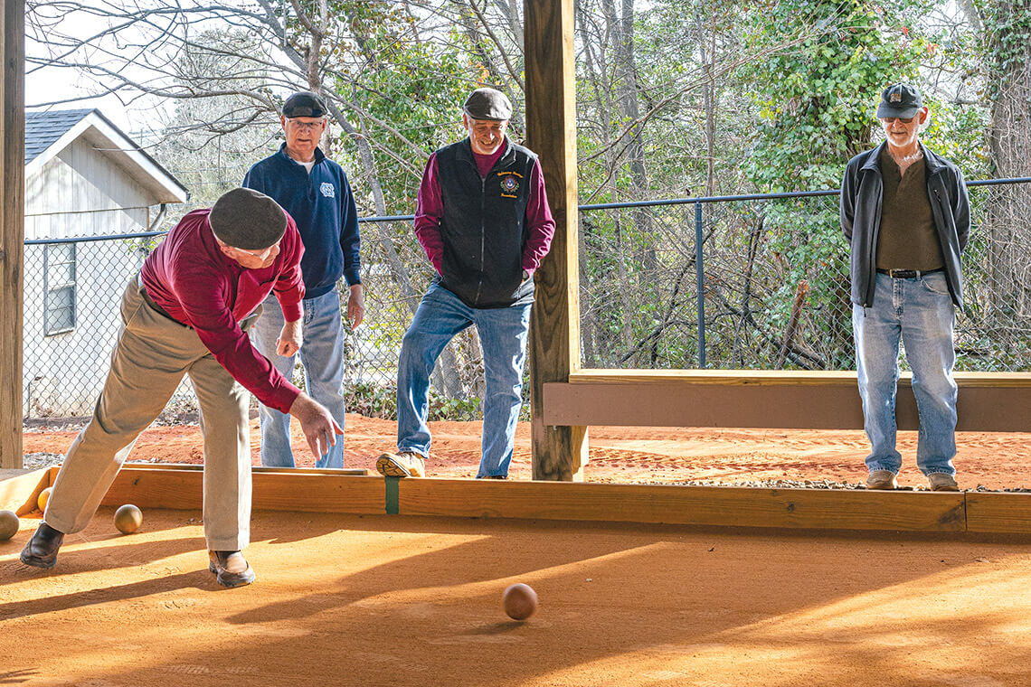 A group of men regularly play bocce in Valdese.