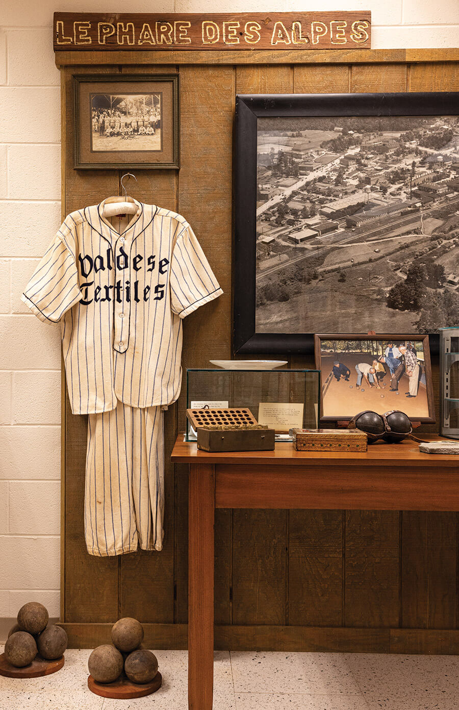 Bocce balls, a Valdese Textiles jersey and pro-flare pants, and historic images of past Waldensian life inside the Waldensian Heritage Museum.