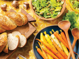 Dishes from the Moog's Musical Eatery cookbook, including crab stuffed mushrooms, olive celery salad, herb carrots with orange butter.