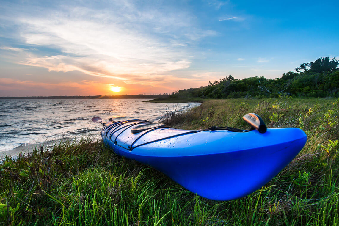 A kayak at the edge of the sound.