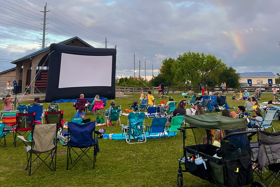 People watch an outdoor movie at Soundside Park.