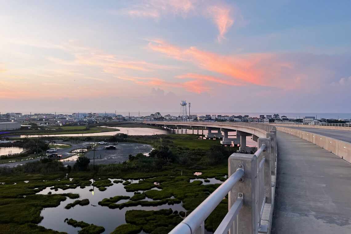 The ocean and the sound are visible from the top of the Surf City Bridge