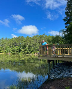 Family visits the pond at Surf City's Community Center