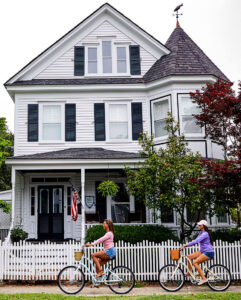 People ride bikes in historic Beaufort, NC.