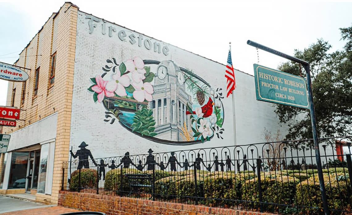 Mural on the side of the Firestone auto store in Historic Downtown Lumberton, NC.