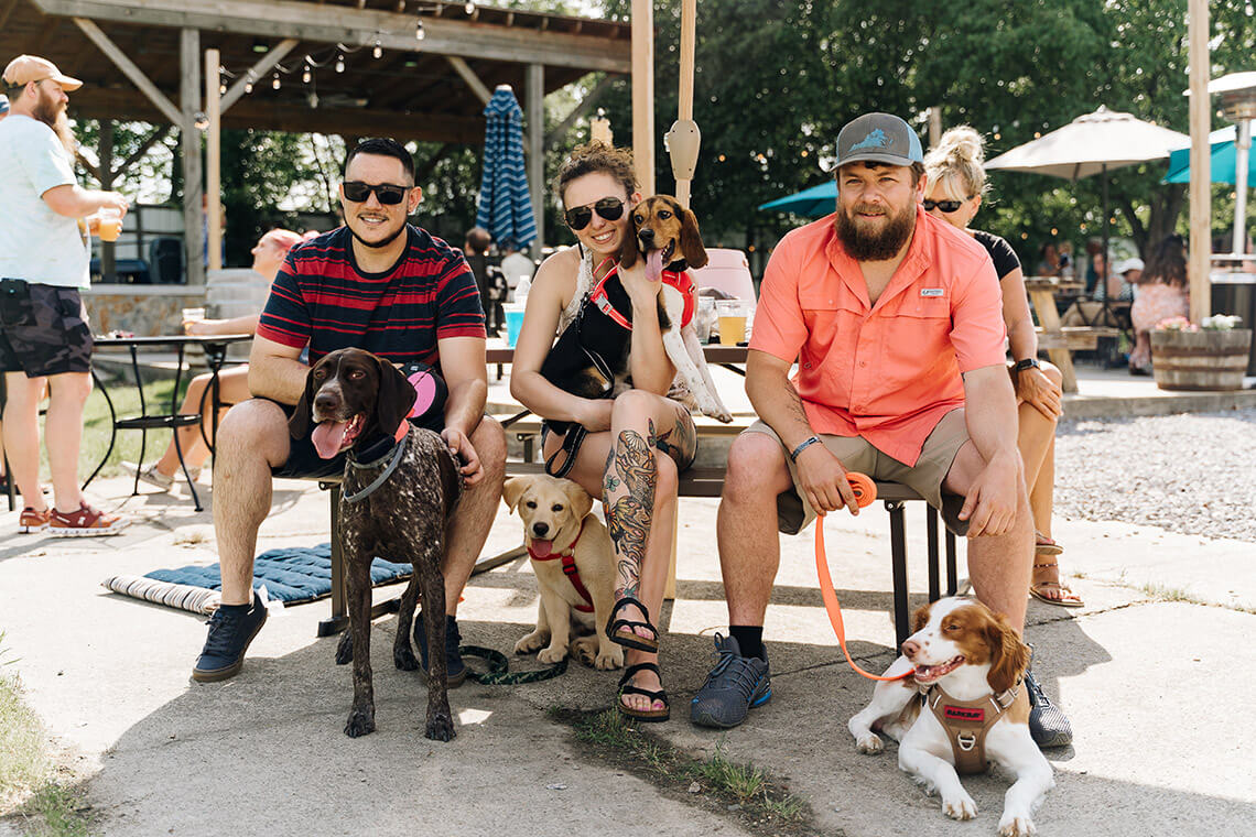 Friends with their dogs at 2 Witches Winery and Brewery