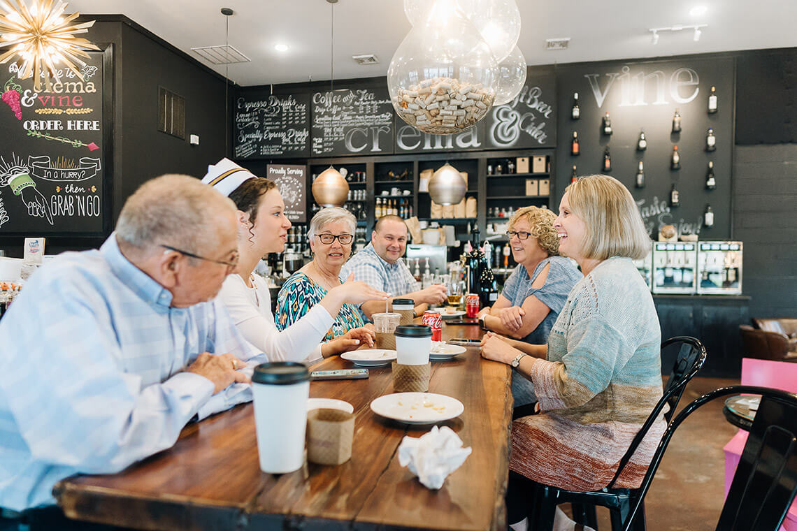 People gather for coffee at Crema & Vine in downtown Danville, Virginia