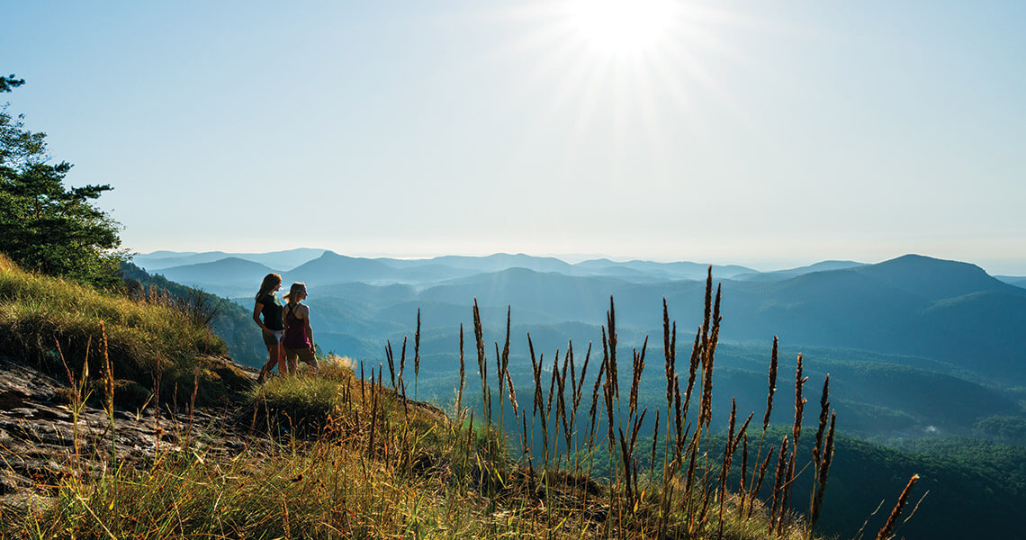 Hikers in Whiteside Mountain, a 10-minute drive from downtown Highlands, NC