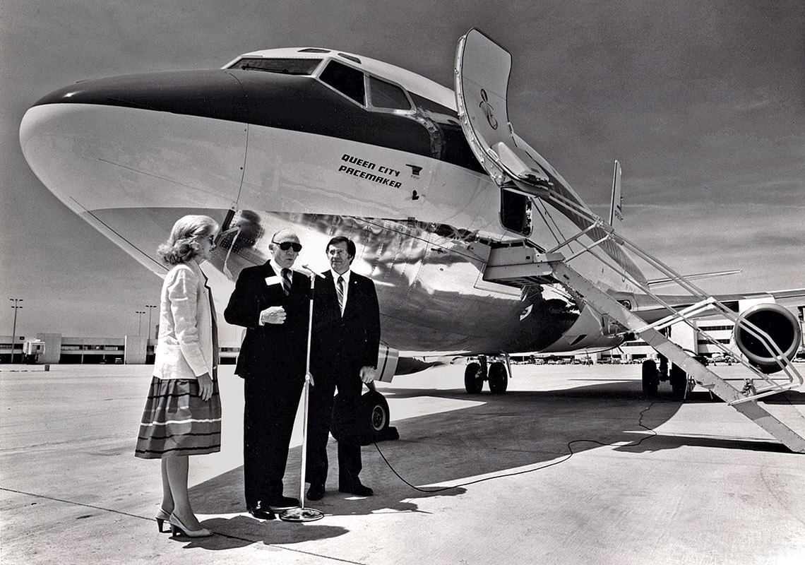 Piedmont Airlines founder and president Tom Davis (center) joined Charlotte Mayor Ed Knox and his wife, Frances, on the tarmac in front of a plane