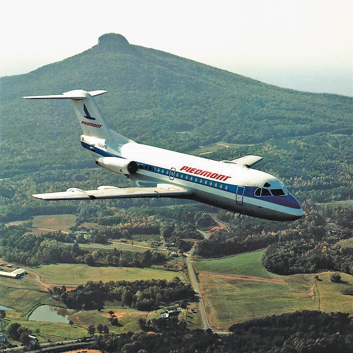 Piedmont Airline plane flies over Pilot Mountain