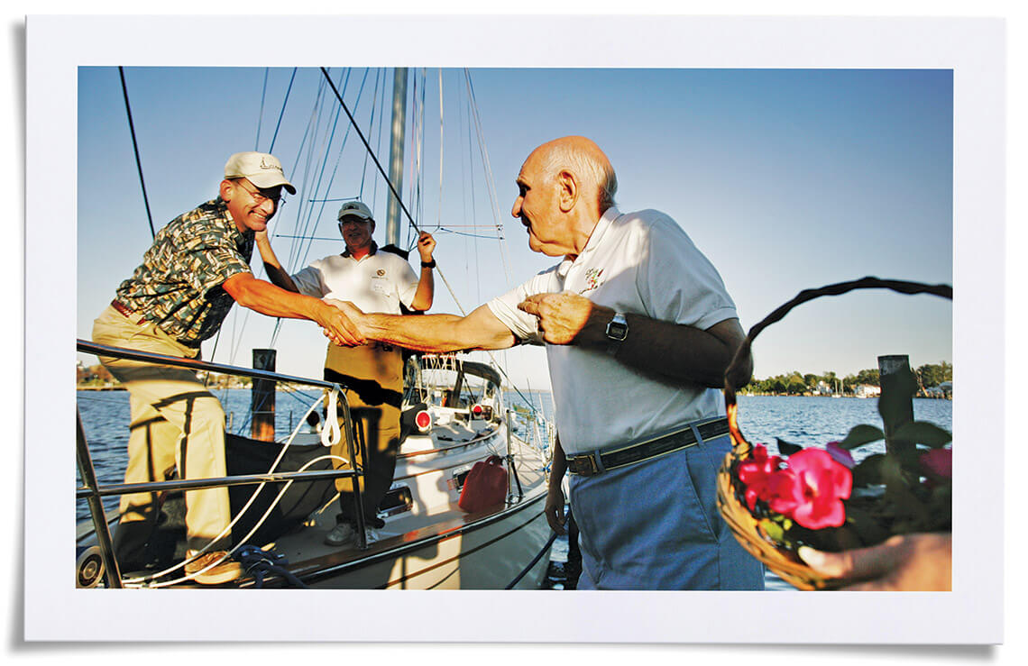 Rose Buddy volunteer Dave Thomas welcomes boaters to Elizabeth City