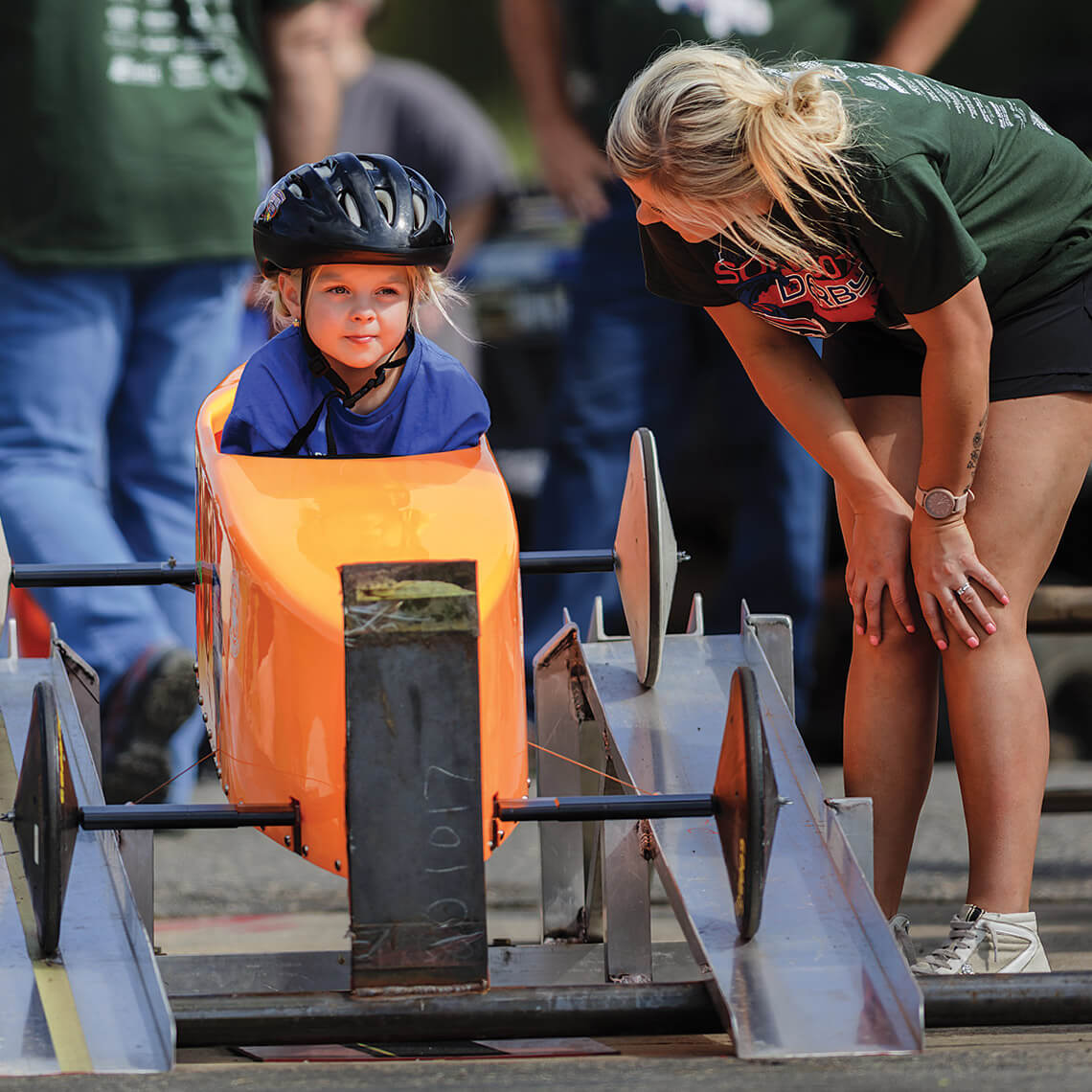 Megan Yancey talks to her daughter Bexley Fredrickson ahead of her Soap Box Derby race