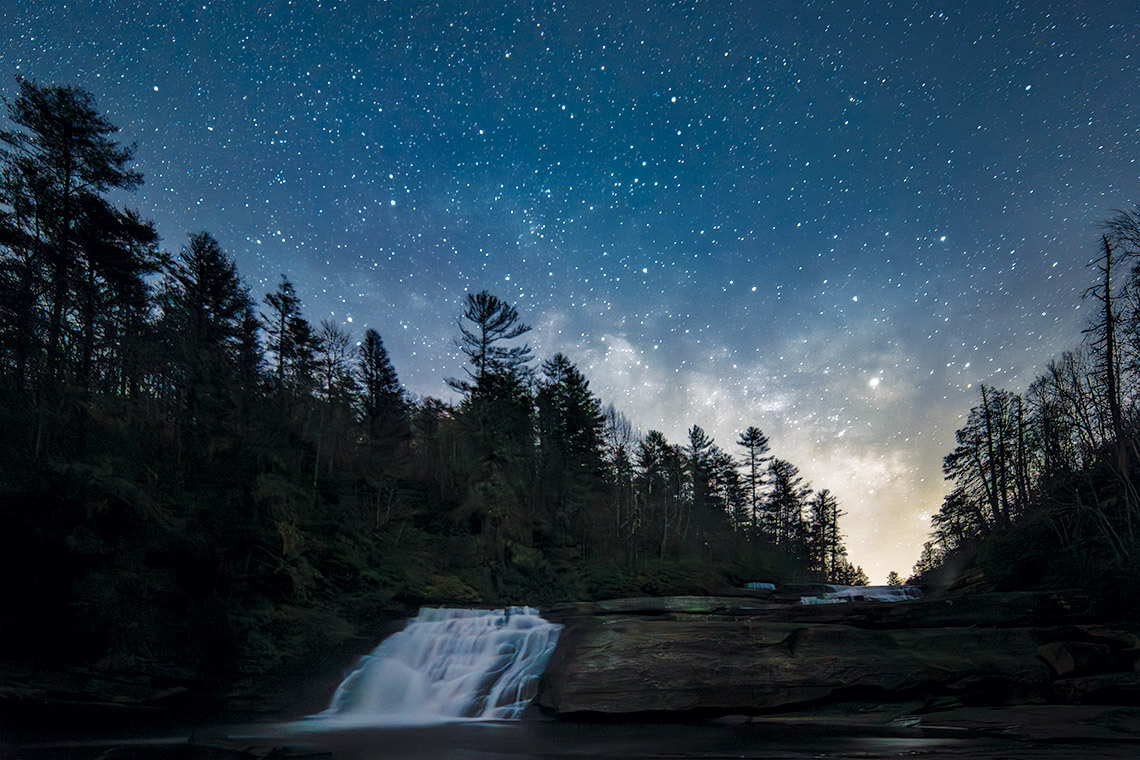 Triple Falls under the starry night sky