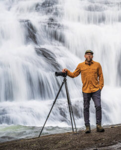 Tom Moor and his camera in front of Triple Falls
