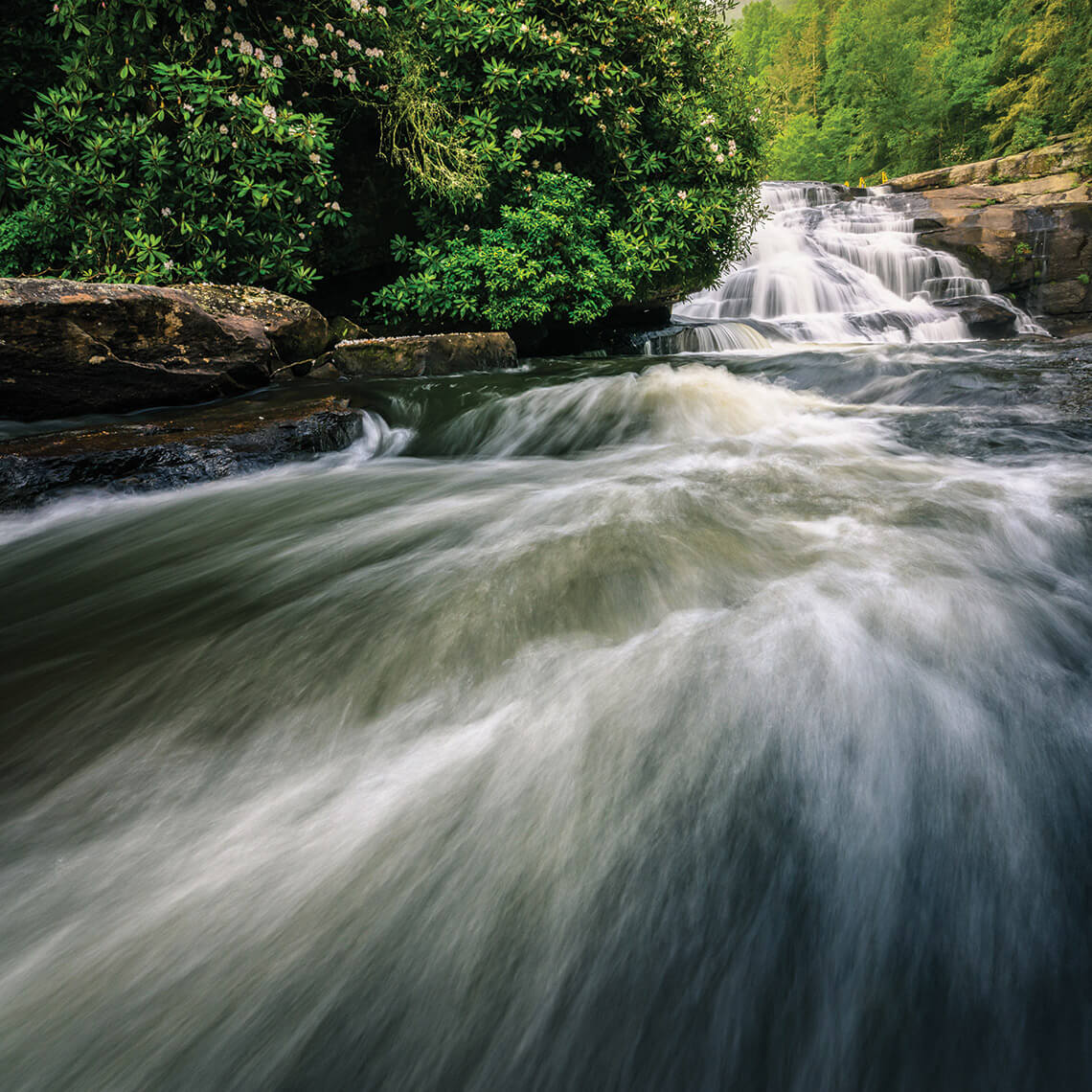 The water cascades down the falls and over rapids at Triple Falls