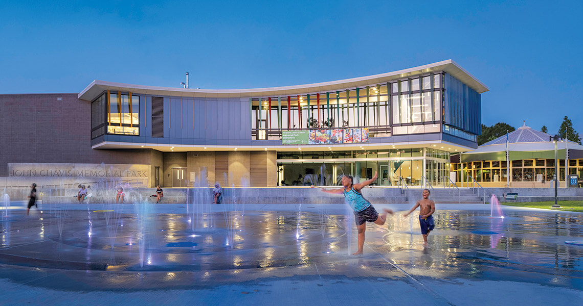 Children play in the fountains at John Chavis Memorial Park