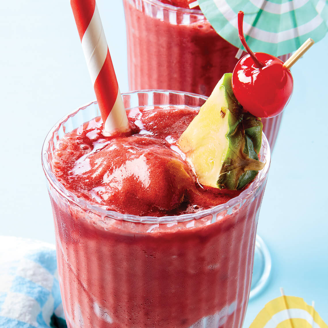 Glass of cherry pineapple slushies