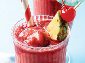 Cherry and pineapple slushie in a glass