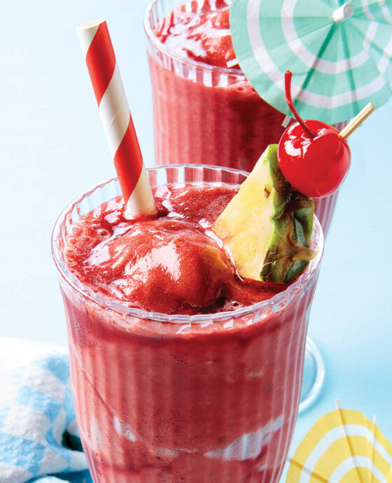 Cherry and pineapple slushie in a glass